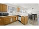 Cozy kitchen with ample counter space, dishwasher, and adjacent dining area with fireplace at 4336 Desert Dancer Way, Las Vegas, NV 89147