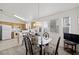 Bright kitchen with dining area featuring modern lighting and neutral color palette at 4336 Desert Dancer Way, Las Vegas, NV 89147