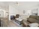 Bright living room with fireplace, comfortable seating and natural light at 4336 Desert Dancer Way, Las Vegas, NV 89147