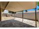 Covered back patio featuring a brick wall and convenient storage shed at 4533 Diamond Head Dr, Las Vegas, NV 89110