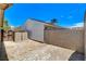 Backyard area with brick accents, storage shed, and block wall providing privacy at 4533 Diamond Head Dr, Las Vegas, NV 89110