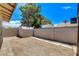 Landscaped backyard, featuring a storage shed, brick wall, and mature trees at 4533 Diamond Head Dr, Las Vegas, NV 89110