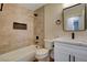 Updated bathroom with tile shower and tub, vanity and sink with bronze fixtures at 4533 Diamond Head Dr, Las Vegas, NV 89110