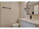 Bathroom showcasing a modern vanity, toilet, and mirror at 4533 Diamond Head Dr, Las Vegas, NV 89110