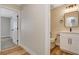 View of the hallway to the bathroom with updated vanity, sink, and lighting at 4533 Diamond Head Dr, Las Vegas, NV 89110