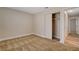 This bedroom features neutral walls, tan carpet, and closet with sliding doors at 4533 Diamond Head Dr, Las Vegas, NV 89110