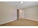 This bedroom includes neutral walls, tan carpet, and closet with sliding doors at 4533 Diamond Head Dr, Las Vegas, NV 89110