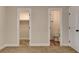 Bedroom with carpet flooring, and views to the walk-in closet and bathroom at 4533 Diamond Head Dr, Las Vegas, NV 89110