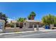 Single-story home with gated entry, desert landscaping, and mature shade trees at 4533 Diamond Head Dr, Las Vegas, NV 89110