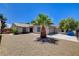 Cozy single-story home with desert front yard and mature palm tree at 4533 Diamond Head Dr, Las Vegas, NV 89110