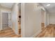 Hallway featuring wood floors and doors to bedrooms and bathroom at 4533 Diamond Head Dr, Las Vegas, NV 89110