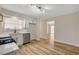 Bright kitchen with stainless appliances, white cabinets and wood-look floors at 4533 Diamond Head Dr, Las Vegas, NV 89110