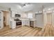 Bright eat-in kitchen with white cabinets, stainless appliances, and light countertops at 4533 Diamond Head Dr, Las Vegas, NV 89110