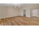Spacious living room featuring wood floors and a contemporary light fixture at 4533 Diamond Head Dr, Las Vegas, NV 89110