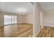 Open-concept living room boasts wood floors and access to the backyard at 4533 Diamond Head Dr, Las Vegas, NV 89110