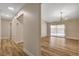 Open floor plan with wood flooring, recessed lighting and sliding glass door to backyard at 4533 Diamond Head Dr, Las Vegas, NV 89110