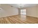 Open living room with wood floors and a sliding door to the backyard patio at 4533 Diamond Head Dr, Las Vegas, NV 89110