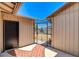 Private courtyard with decorative brick flooring, a secure gate and an exterior door at 4533 Diamond Head Dr, Las Vegas, NV 89110