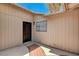 Enclosed patio featuring a dark wood door and unique tile accents at 4533 Diamond Head Dr, Las Vegas, NV 89110