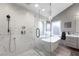 Luxurious bathroom with a glass-enclosed shower and a freestanding tub for ultimate relaxation at 5125 Turnberry Ln, Las Vegas, NV 89113