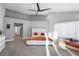Bedroom featuring vaulted ceiling, ceiling fan, plush carpeting, and lots of natural light at 5125 Turnberry Ln, Las Vegas, NV 89113