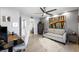 Office area with a sofa, workspace, and ample storage, featuring a large window and modern decor at 5125 Turnberry Ln, Las Vegas, NV 89113