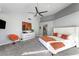 Bright bedroom with vaulted ceiling, ceiling fan, neutral decor, and comfortable sitting area at 5125 Turnberry Ln, Las Vegas, NV 89113
