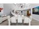 Bright dining room boasts a modern chandelier, staircase, and open-concept design at 5125 Turnberry Ln, Las Vegas, NV 89113