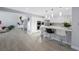 Open-concept kitchen and dining area featuring stainless steel appliances and a breakfast bar at 5125 Turnberry Ln, Las Vegas, NV 89113