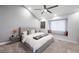 Comfortable bedroom with a ceiling fan and a cozy reading nook near the window at 5125 Turnberry Ln, Las Vegas, NV 89113