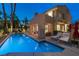 A pristine pool with sun loungers and an open-air patio offer an oasis for relaxation and entertaining at 5125 Turnberry Ln, Las Vegas, NV 89113