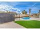 Enjoy this backyard's refreshing pool, shed, privacy fence, and artificial grass at 5239 Elgin Cir, Las Vegas, NV 89122