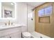 Modern bathroom features a walk-in shower with a niche and updated vanity with gold hardware at 5239 Elgin Cir, Las Vegas, NV 89122