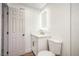 Contemporary bathroom with an illuminated mirror and a modern vanity with gold hardware at 5239 Elgin Cir, Las Vegas, NV 89122