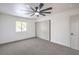 Inviting bedroom boasts gray carpet, a ceiling fan, and a large closet for ample storage at 5239 Elgin Cir, Las Vegas, NV 89122