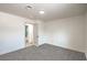 Comfortable bedroom features a ceiling light and an access door to an ensuite bathroom at 5239 Elgin Cir, Las Vegas, NV 89122