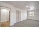 Bright bedroom features gray carpet, a sliding closet, and natural light from a window at 5239 Elgin Cir, Las Vegas, NV 89122