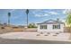 Inviting single-story home boasts drought tolerant landscaping and a large driveway at 5239 Elgin Cir, Las Vegas, NV 89122
