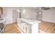 Bright, open kitchen features an island with white countertops and ample cabinet space at 5239 Elgin Cir, Las Vegas, NV 89122