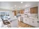 Bright kitchen boasts stainless appliances, island with seating and access to the outdoor pool at 5239 Elgin Cir, Las Vegas, NV 89122