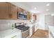 Modern kitchen features stainless appliances, white countertops and a gas range at 5239 Elgin Cir, Las Vegas, NV 89122