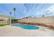 Backyard pool features lush green turf and a diving board, perfect for summer fun at 5239 Elgin Cir, Las Vegas, NV 89122