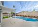 Relaxing pool area with a covered patio and blue swimming pool, perfect for outdoor enjoyment at 5239 Elgin Cir, Las Vegas, NV 89122