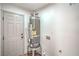 Spacious utility room with a new water heater, laundry hookups, and a door to outside at 5239 Elgin Cir, Las Vegas, NV 89122