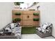 Landscaped backyard featuring outdoor seating and well-maintained artificial grass at 5400 Tassara Way # 106, Las Vegas, NV 89108