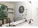 Modern bathroom with dual sinks, a decorative mirror, and ample counter space at 5400 Tassara Way # 106, Las Vegas, NV 89108