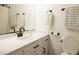 Bathroom featuring vanity, mirror and updated fixtures at 5400 Tassara Way # 106, Las Vegas, NV 89108