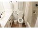 Bathroom featuring a toilet, sink, and vanity with black hardware at 5400 Tassara Way # 106, Las Vegas, NV 89108