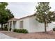 Charming home exterior featuring a red tile roof and well maintained landscaping at 5400 Tassara Way # 106, Las Vegas, NV 89108