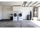 Garage interior featuring washer, dryer, water heater and overhead storage at 5400 Tassara Way # 106, Las Vegas, NV 89108